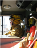 sideview of firefighter in yellow uniform