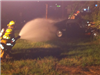 firefighter shooting water from a hose