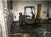 forklift covered in grey soot
