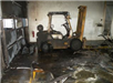 forklift covered in grey soot