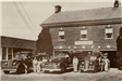 Men in front of Fire Trucks