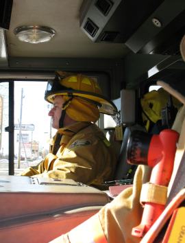sideview of firefighter in yellow uniform