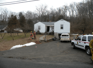 road and snow on grass