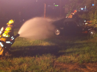 firefighter shooting water from a hose