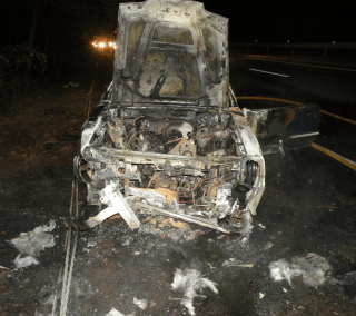 car covered in grey soot