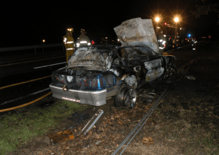 car covered in grey soot