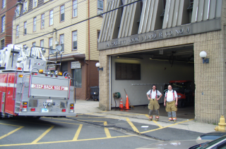 firefighters standing in front of entrance
