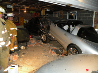 grey car crashed into another car