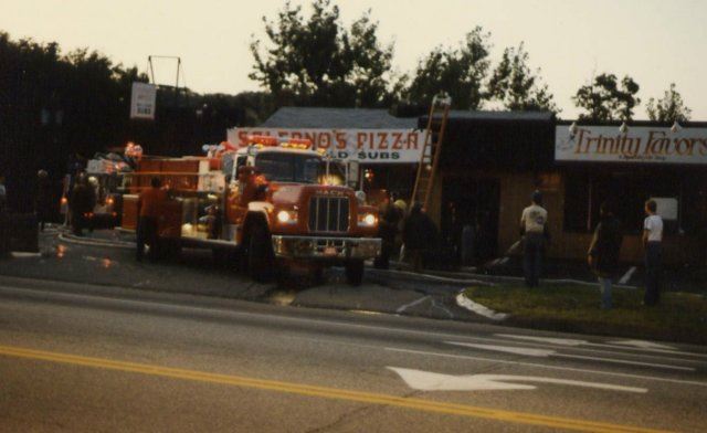 Red Fire Truck in Front of Salernos Pizza and Trinity Favors 