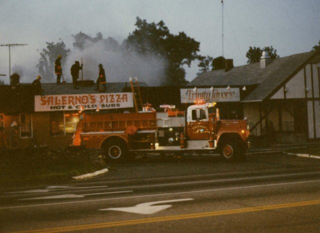 Red Fire Truck in Front of Salernos Pizza and Trinity Favors