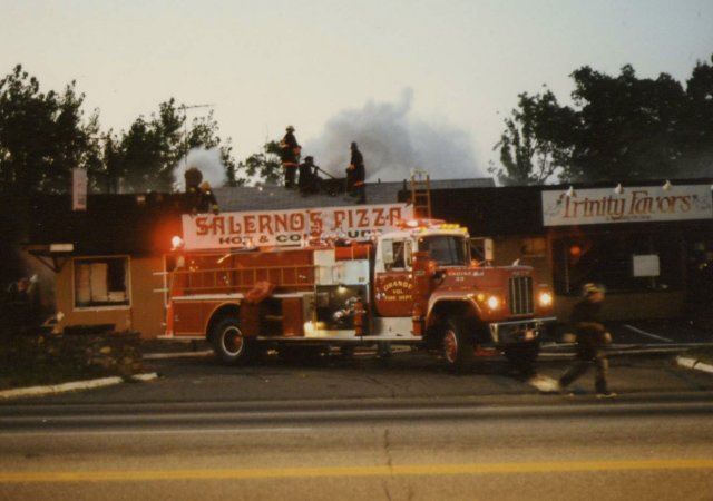 Red Fire Truck in Front of Salernos Pizza and Trinity Favors 
